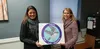 Finger Lake Principal Susan Steele and instructional coach Marcy Farris display the school's logo. Jacob Mann/Frontiersman