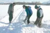 TODD L DISHER/Frontiersman Golfers kick their way through the
fresh snow looking for their multi-colored balls in this year’s
“Ice Hole Classic” on Wasilla Lake.