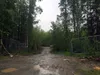 The driveway leading to a property on Coal Drive in Meadow Lakes where Alaska State Troopers say two people were shot and killed on Sunday, June 5, 2016. Matt Tunseth