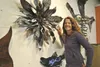 Holly Gettlein poses for a portrait with one of her pieces. Hattie Schmidtkunz/For Frontiers