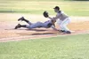 Alaska Road Warriors infielder Jonathon Boyer slides back into
first base during the 2011 Alaska American Legion State
Championships. Boyer has been named all-state. (JEREMIAH
BARTZ/Frontiers