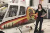 Tosha Cypher stands next to a Robinson R-44 helicopter in the hangar of Tanalian Aviation on Tuesday, April 12. Along with training for her commercial pilot’s license at the company, the Palm