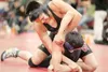 ROBERT DeBERRY/Frontiersman Wasilla’s Josh Brown puts a hold on
Colony wrestler Javier Gonzales during a 135-pound match Friday at
Houston High School.