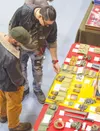 Visitors check the merchandise during the 2024 Wasilla High Gun Show.