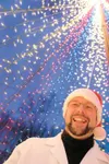 ROBERT DeBERRY/Frontiersman Mad scientist Jeff Mitchell stands
inside his 20-foot Christmas tree made of twinkle lights at his
Tennyson Court home off Knik-Goose Bay Road. Mitchell has create