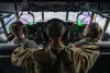U.S. Air Force Capt. Logan Collier, left, and 1st Lt. Emily Nole, right, 39th Airlift Squadron C-130J Super Hercules pilots from Dyess Air Force Base, Texas, pilot a C-130J as Staff Sgt. Nola