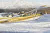 A plane is tied down in the snow at the Palmer Municipal
Airport. A dispute with the U.S. Department of Justice over funds
used at the city airport is approaching a settlement, with the city
