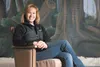 Wizard of Oz backdrop painter Dawn Alger sits in front of a
wooded scene backdrop inside a warehouse in Wasilla. Alger is
painting all four backdrops for the upcoming Valley Performing Arts
p