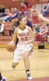 Wasilla senior Celeste Colegrove looks for an open teammate
during Wednesday's game against Oregon's Newberg Tigers during the
Doc Larson Roundball Classic at Wasilla High School. (ROBERT
deB