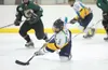 ROBERT DeBERRY/Frontiersman Alaska Avalanche forward Matt Friese
drops to his knees while trying to control the puck during Friday’s
game against the Kenai River Brown Bears.