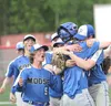 The Palmer Moose celebrate after securing the final out during the ASAA Division II state championship game. Palmer beat Kodiak to win its first state title in school history. Jeremiah Bartz/