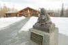 ROBERT DeBERRY/Frontiersman A statue of Joe Reddington Sr. sits
outside the Iditarod Trail Headquarters in Wasilla.The city leases
the land on which the headquarters is located to the organiz
