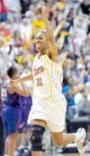 Indiana Fever center Jessica Moore celebrates the Fever’s 86-85
win over the Phoenix Mercury in the third game of the best-of-5
WNBA basketball finals, in Indianapolis last Sunday. Moore is a