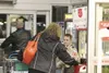 A customer at a local store drops money into a Salvation Army donation bucket. Frontiersman file photo