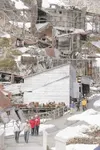 ROBERT DeBERRY/Frontiersman Visitors to Independence Mine State
Historical Park at Hatcher Pass make their way down the partialy
snow-covered walkway from the old mining camp’s assay office i