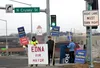 Supporters of Edna DeVries hold signs in Wasilla. DeVries won the race for Mat-Su Borough Mayor. Jacob Mann/Frontiersman
