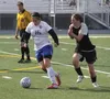 Palmer senior Charlotte Forrest tries to beat Colony's Brice Pavlicek up the field during a 1-1 tie with the Knights May 15 at Palmer High. Jeremiah Bartz