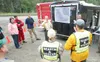 (ROBERT DeBERRY/Frontiersman) Palmer Police detective Kelly
Turney breifs search and rescue personal at the command center set
up at the Matanuska River bridge in Palmer Wednesday afternoon.
