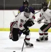 Houston junior defenseman Reed Humphreys powers up the ice during a 3-3 tie against Monroe Catholic. Humphreys was recently named the Greatland Conference Player of the Year. Courtesy of Bruc