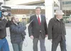 Vic Kohring talks to the media as he leaves the federal courthouse in Anchorage with Lawyer Wayne Anthony Ross, right, during his trial in October 2007. Frontiersman file photo