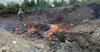 A Mat-Su Borough employee attends to a burning brush pile at the Big Lake Transfer Station. Courtesy photo provided by MSB