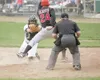 Mat-Su Miner catcher Wes Dorrell scrambles to tag Peninsula
Oiler Anothony Aliotti at home plate during Thursday game at Hermon
Brothers Field. (ROBERT DeBERRY/Frontiersman)