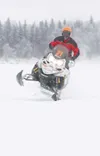 ROBERT DeBERRY/Frontiersman Mike Morgan goes airborn after
hitting a small bump on Big Lake Sunday during the start of the
2009 Tesoro Iron Dog.
