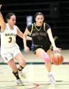 Susitna Valley's Lily Esmailka drives down the floor against Unalakleet during the 2A state tournament. Bruce Eggleston/matsusports.net