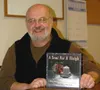 CASEY RESSLER/Frontiersman Mark Mendonsa took his idea of a
childrens book about Christmas, with a trucker theme, to the Book
Bonanza and met with publisher Evan Swensen. The book was release