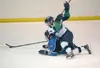 Alaska's Chase Van Allen puts Wenatchee's Matt Cope on the ice
during Friday's game at the MTA Palmer Ice Arena. (ROBERT
DeBERRY/Frontiersman)