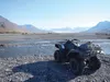 An ATV sits next to the water in the Knik River watershed. Courtesy Chuck Kaucic