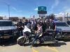 Tyler Karach posses with Wasilla Police Department officers during a recent trip to the station. The Florida boy has traveled to 36 states on his nationwide quest to personally thank police o