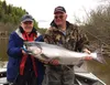 Andy Couch owner of Fishtale River Guides and a client proudly display a King Salmon caught on the Deshka River.JPG
