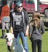 Ginger Jaksha stands with her dog, Maximus, at Saturday’s event at the Regine Dog Training Facility in Wasilla. Jaksha and her family had always been ‘cat people’ until one day she had a drea