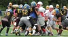 The Wasilla Warriors front line tries to push forward during a scrimmage against Bartlett prior to the start of the 2016 regular season. Halfway through the season, the Warriors are now 2-2. 