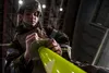 U.S. Air Force Airman 1st Class Zachary Rodgers, a 354th Operations Support Squadron airfield management shift lead, marks a chemical detection stanchion during the ability to survive and ope