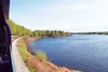 Alaska Railroad’s Denali Star engine wraps around a bend on the edge of Nancy Lake on its run from Talkeetna to Wasilla Friday. A speedboat skips across the ripples in the lake, visible from 