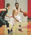 Wasilla guard Armondo Dobbs brings the ball down the floor for the Warriors during a win over Colony Tuesday. Dobbs was one of a handful of Warriors reserves who played key minutes during the