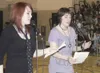 Burchell High School performance poets Ashlee Twiford, left, and
Kat Chudnofsky share their original creation ‘Diversity Means This’
during the Stand Against Racism assembly at Colony Middle 