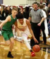 Wasilla senior Daniel Headdings works to drive past Colony's Colton Spencer during a 68-60 win over the Knights Tuesday at Wasilla High School. Courtesy of Bruce Eggleston/matsusports.net