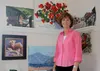 Glacer View resident Suzie Althens poses with some of her art Feb. 22. STEVEN MERRITT/Frontiersman