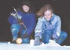 Wasilla High School student Scharri James learns how to take
snow samples while UAF researcher Kim Morris looks on.