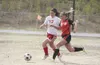Wasilla defender Erin Murry races a Kenai Central player to the
ball in Saturday’s third-place match. (JEREMIAH
BARTZ/Frontiersman)