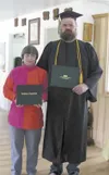 Tom Schill and wife, Connie Schill, in their home near Sutton after Tom graduated with a degree in drafting. Schill was killed almost a year later in a crash just outside their home on the Gl
