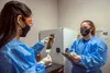 Alejandra Ornelas, a research pharmacy technician with Operation Warp Speed, documents and verifies whether a patient received a vaccine or placebo at Joint Base San Antonio, Oct. 28, 2020. T