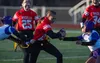 Wasilla quarterback Savannah Kroon tries to weave through traffic during a 19-14 loss to Lathrop. J. David McChesney/Frontiersman