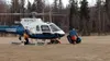 Personnel from the Alaska Mountain Rescue Group offload ropes and other equipment after a grueling Matanuska Peak rescue March 29. Helicopters transported three injured hikers from near the t