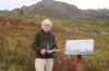 Former Alaska poet laureate and university professor Tom Sexton stands beside his poem after it was unveiled near Independence Mine in Hatcher Pass on Aug. 30. Caitlin Skvorc/Frontiersman