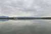ROBERT DeBERRY/Frontiersman A float plane taxis across the still
waters of Lake Lucille Monday afternoon. The 40-plus-year-old
wooden dam spillway at the west outlet of the lake is on the ver