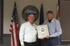 Councilman Stu Graham participated in his last meeting as a member of the council on October 12 and was presented with a framed seal of the city of Wasilla by Mayor Bert Cottle. Tim Rockey/Fr